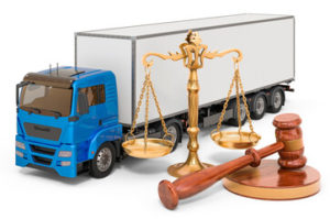 hammer and gavel with semi truck on the background- truck accident case concept
