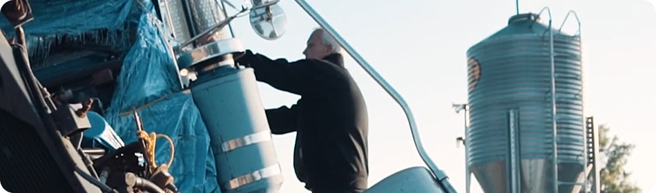 man checking a truck accident