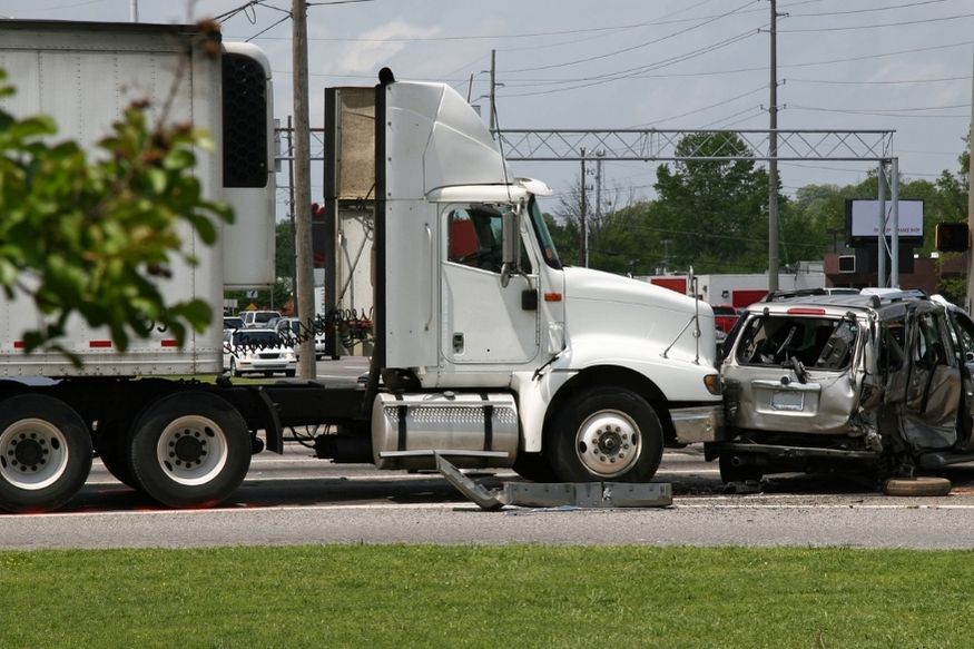 Truck and car crashed in the middle of a road