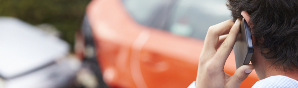 man calling attorney after car accident