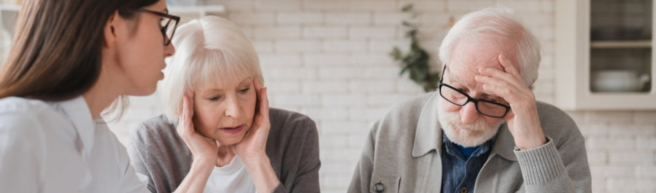 Elderly couple meeting with their lawyer