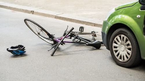 Damaged bicycle laying in the road
