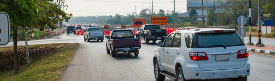 Vehicles driving through construction zone