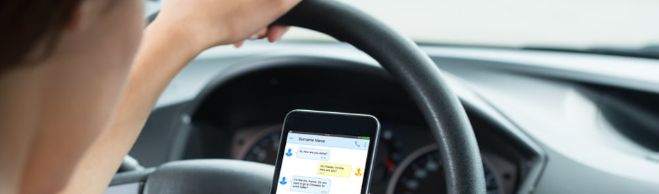 Female driver texting while driving
