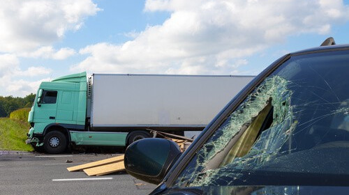 truck causes windshield damage to car