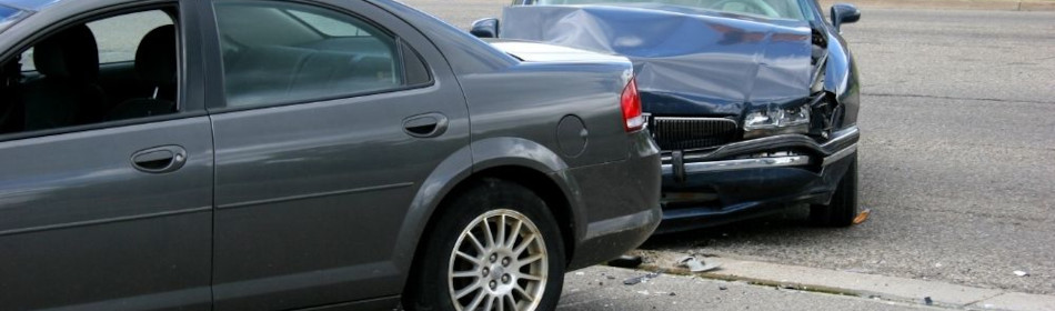 Two cars parked after colliding