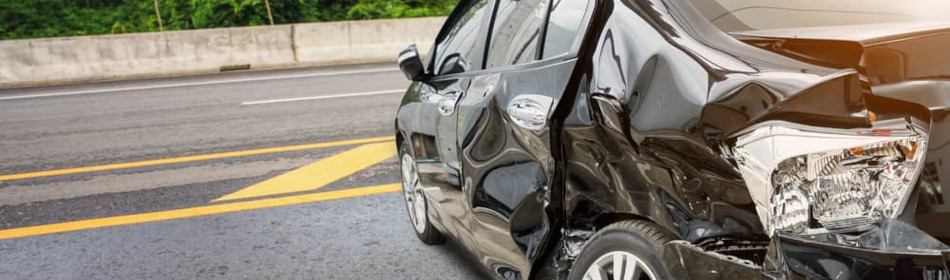 crashed car in the middle of the road