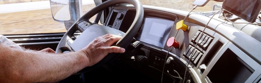 Trucker looking at his phone while driving