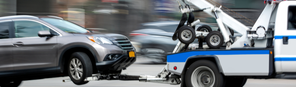 a tow truck with a car to tow