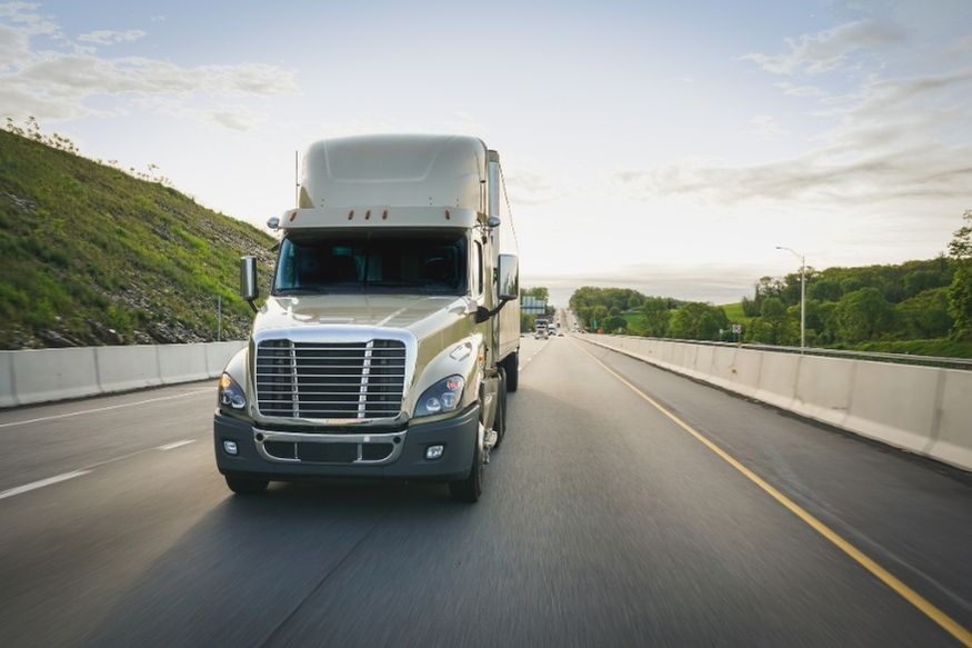 White truck driving on road